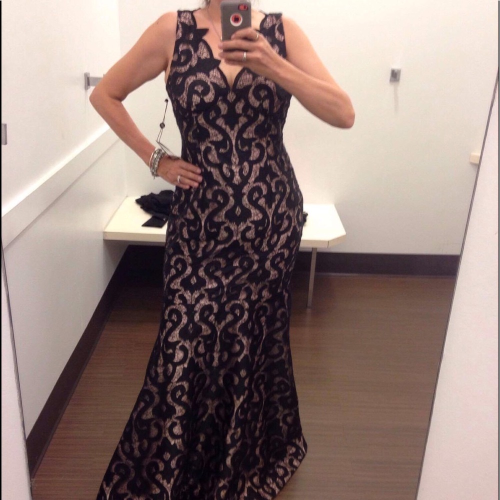Form fitting lace dress. Very expensive and nice.